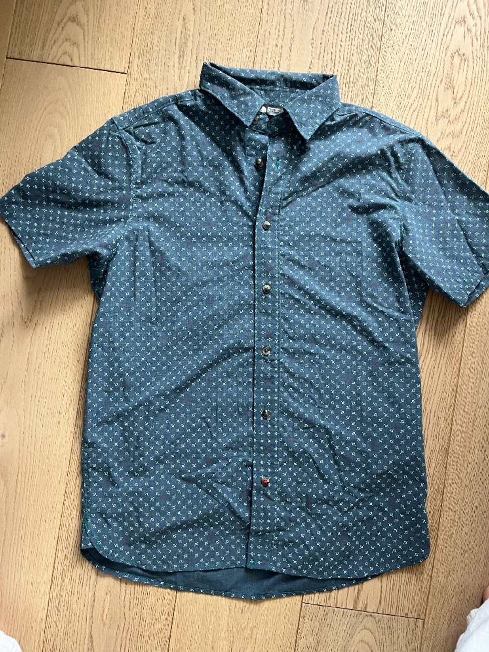 The North Face Men's blue button up shirt Medium